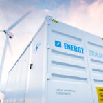 A white structure labeled "energy storage" sits between wind turbines and solar panels.