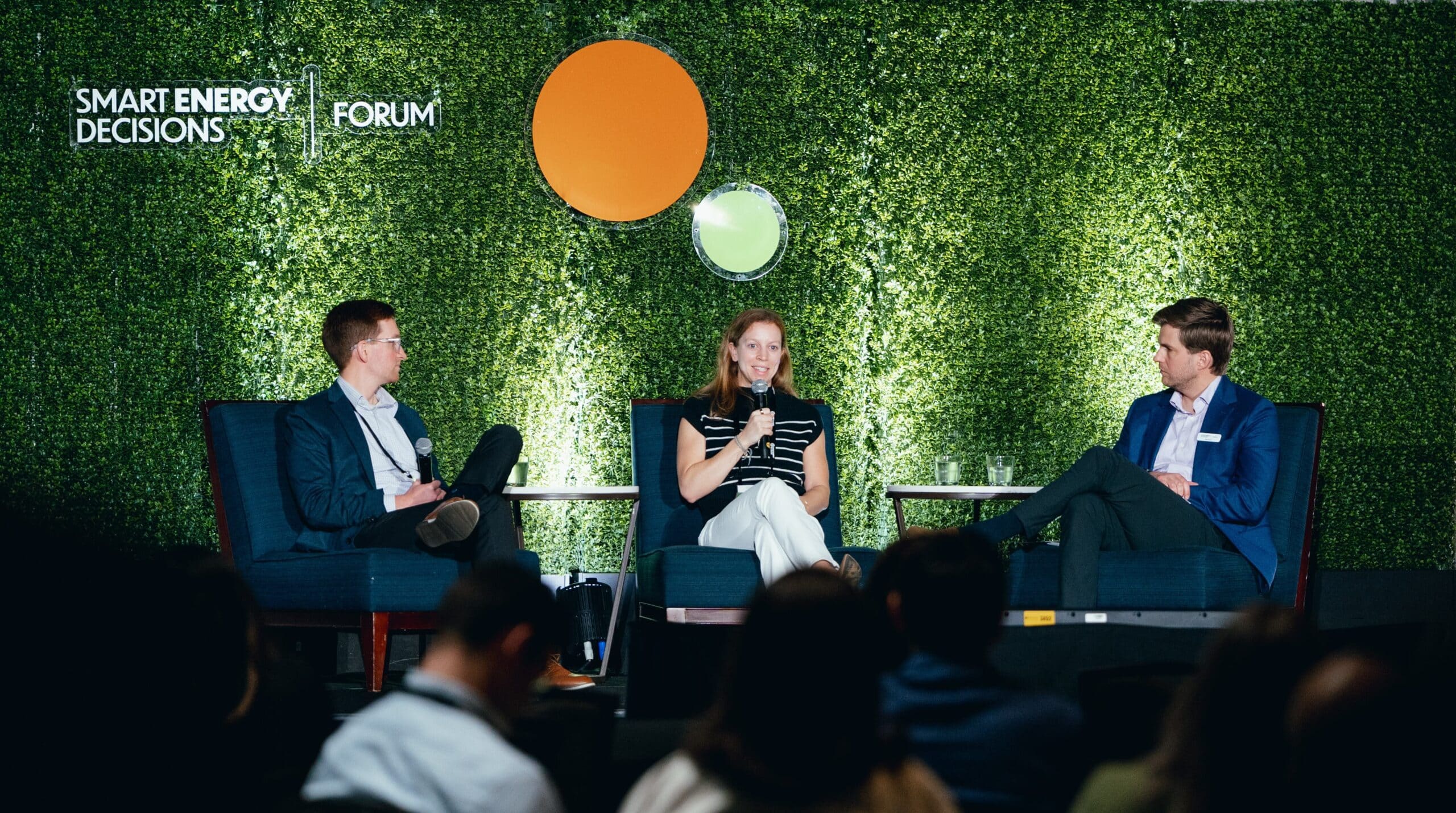 Three panelists present onstage