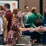 A buyer and supplier shake hands at the SED Forum
