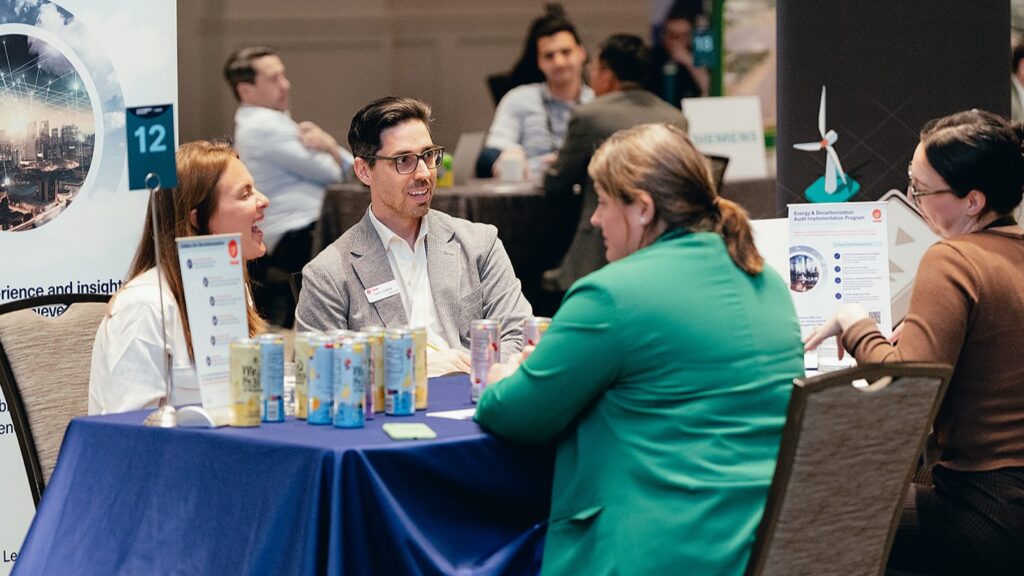 People engage in one-to-one meetings at SED Forum